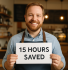 A smiling small business owner wearing a blue shirt and apron, proudly holding a sign that reads “15 HOURS SAVED” inside a cozy, well-lit shop with wooden shelves and warm pendant lighting.