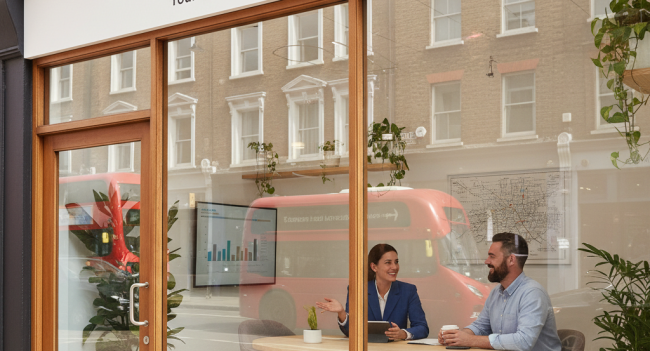 A welcoming image of a local accountant's office storefront or a professional meeting between an accountant and small business owner in a bright, modern office setting. Should convey approachability, trust, and local presence - perhaps showing a recognizable London street scene or local business district to emphasize the "near me" aspect.