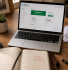 Small business owner's desk showing VAT registered dashboard for how to register for VAT UK 2026