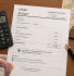 CT600 form with calculator and UK currency showing how to reduce corporation tax legally for British limited companies.