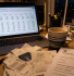 Limited company director sorting business expenses on a laptop at home with receipts and HMRC paperwork