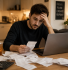 Self-employed professional reviewing finances at home needing an accountant for self-employed support