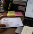 Business owner opening an HMRC letter next to a laptop running MTD VAT-compliant accounting software