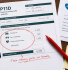 P11D form on a desk surrounded by company car keys, a gym card and a medical insurance letter, representing common benefits in kind.