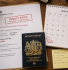 UK director's desk showing Companies House filing deadline calendar, penalty notice and passport for identity verification
