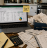 Sole trader doing tax return at home with receipts and laptop