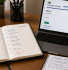 A UK company director's desk with a diary and laptop open on the Companies House WebFiling confirmation statement login page.