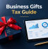 Business gifts tax guide featuring a corporate gift box with red ribbon, accounting charts on a tablet, calculator and gold pen on a professional navy blue desk.